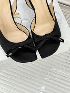 Black bow heeled sandal with Dior logo tag on the strap