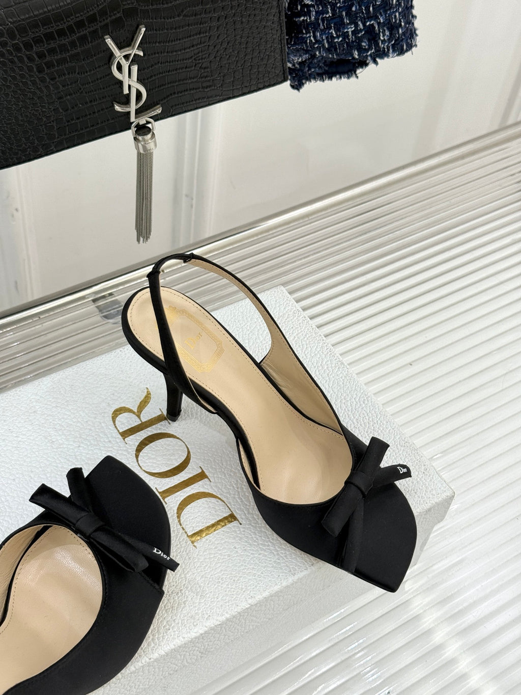 Black heeled sandal with large bow and thin ankle strap