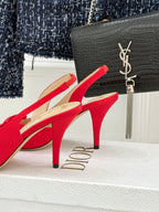 Red stiletto slingback heels with bow detail, close side profile