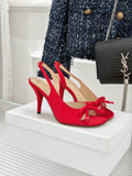 Red stiletto slingback pumps with bow at the toe, beige insole