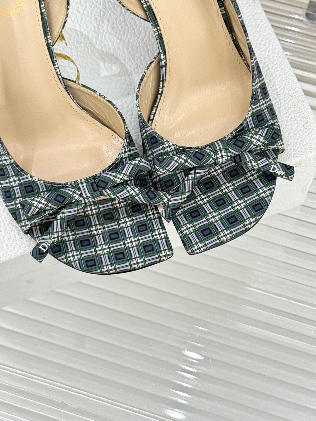 Dior blue plaid slingback heels with bow, close-up of straps