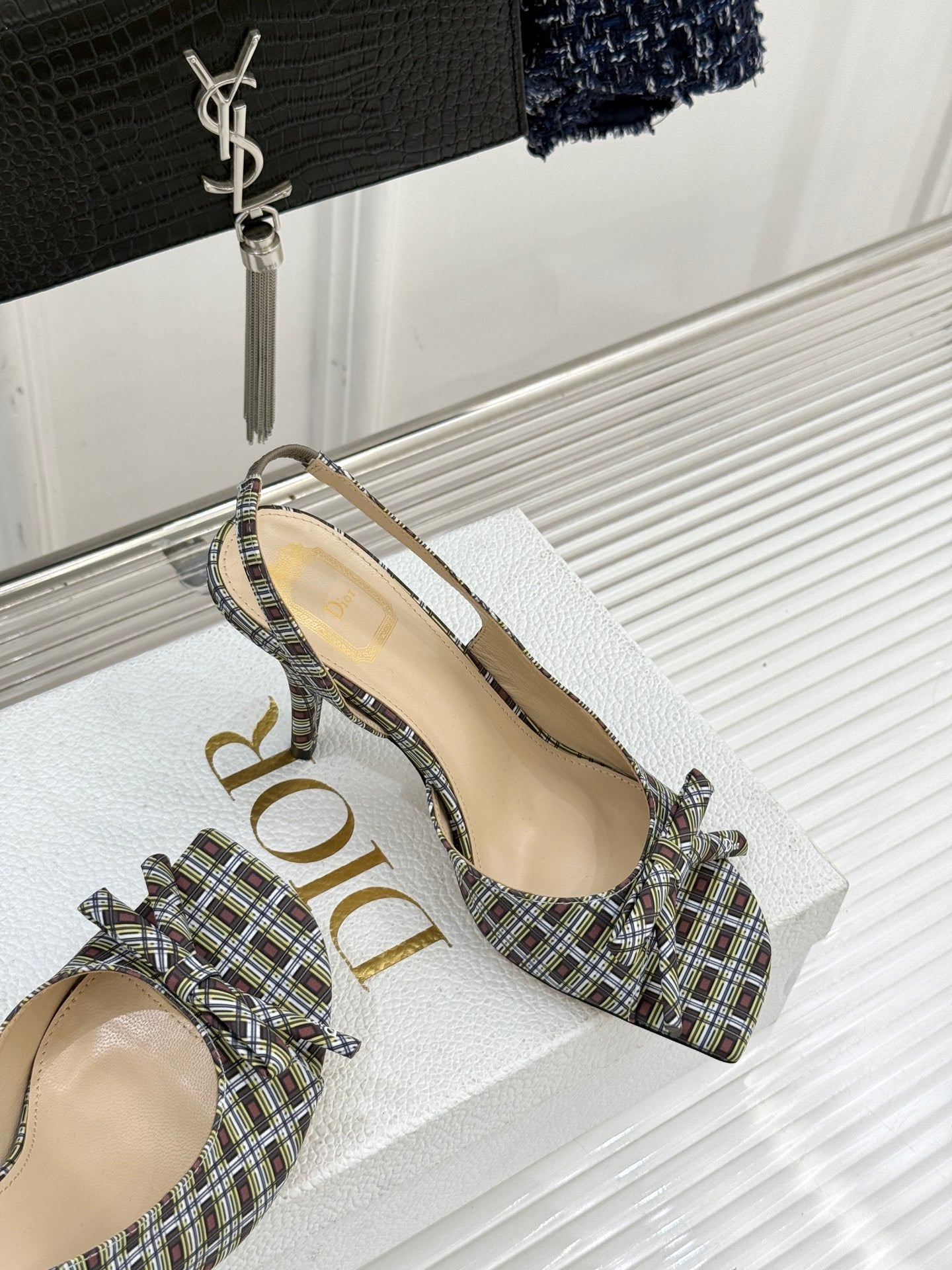 Women’s plaid slingback heeled sandal on display, open toe and slim heel