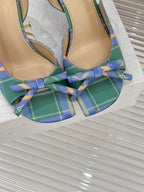 Dior plaid heeled sandals close-up, tied ribbon bow across open toe