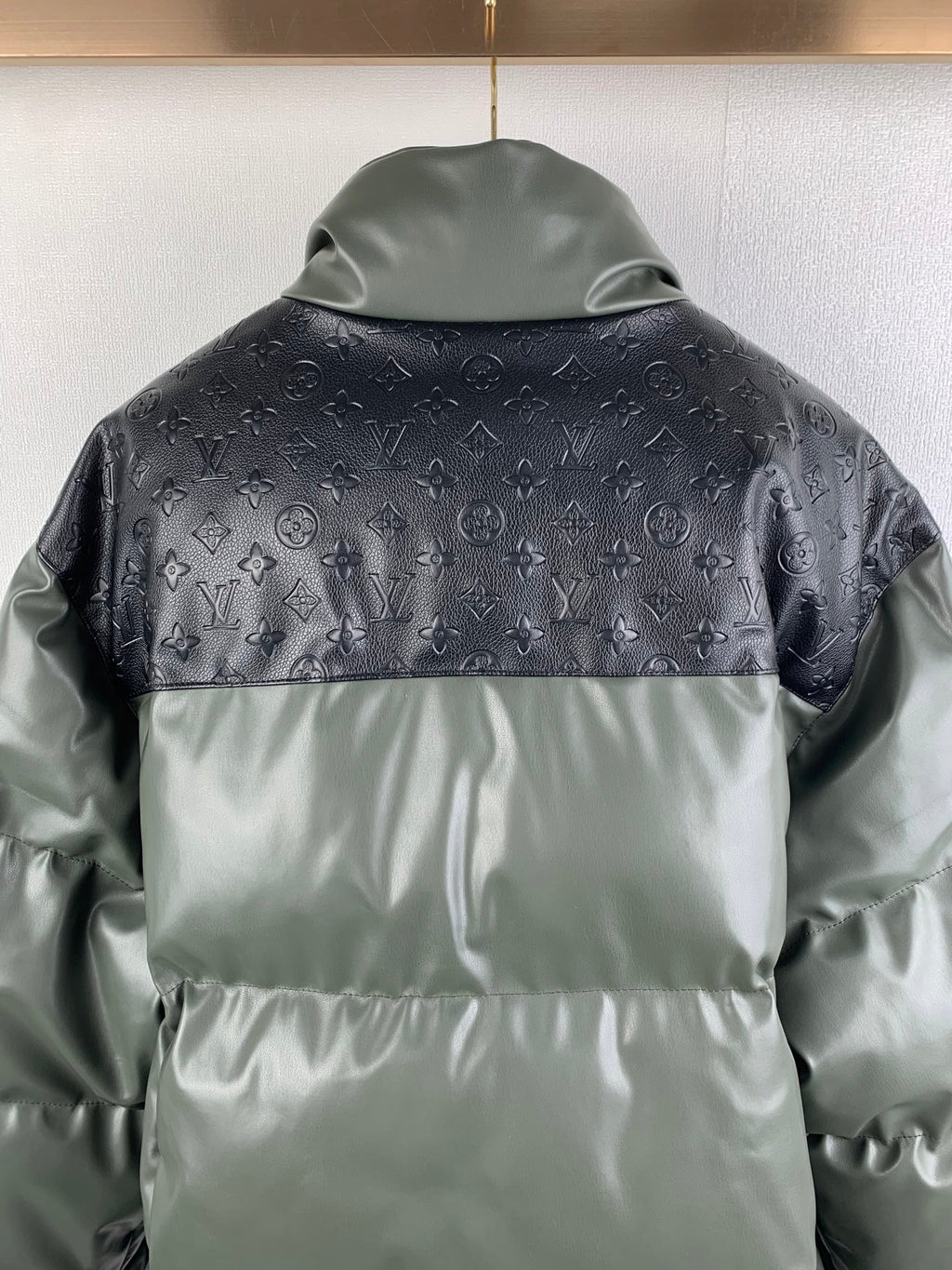 Hooded puffer jacket with monogram pattern and contrasting light gray lower panels