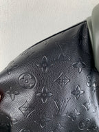 Louis Vuitton monogram leather-look fabric panel, dark embossed pattern