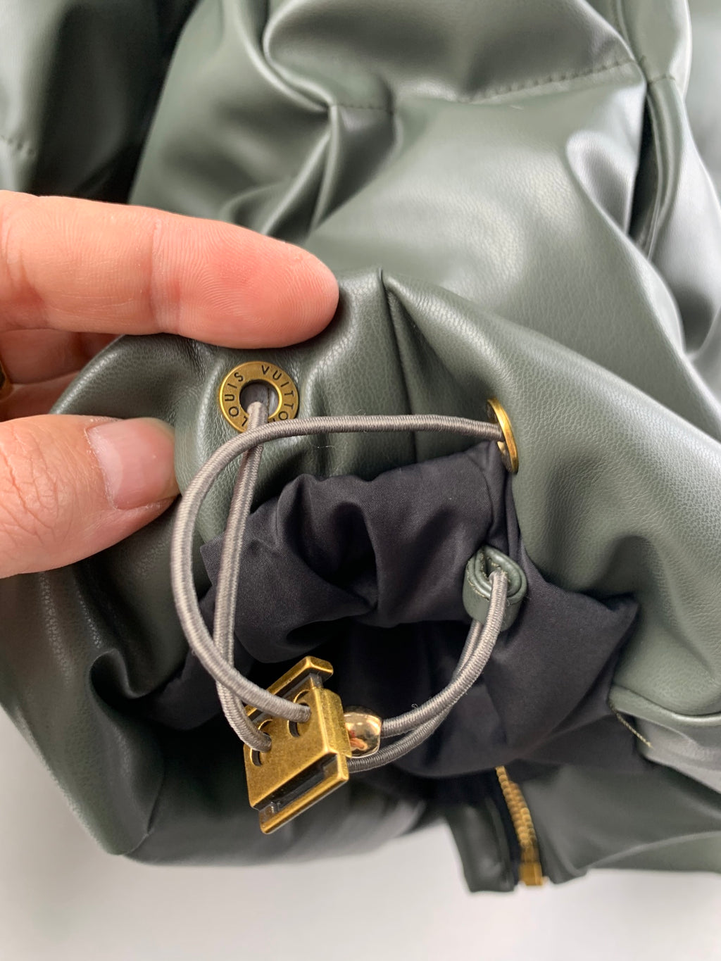 Louis Vuitton puffer jacket hood drawstring with gold toggle