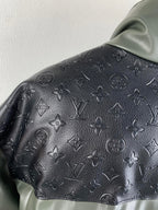 Hooded jacket hood and shoulder with dark monogram emboss texture