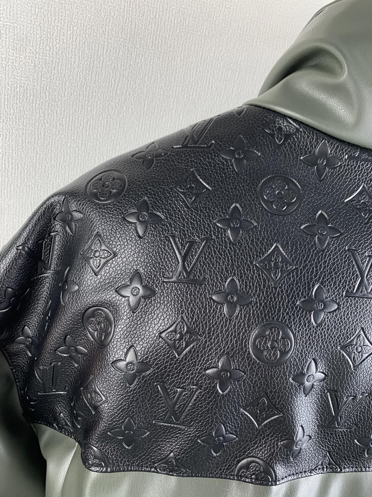 Hooded jacket hood and shoulder with dark monogram emboss texture