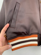 Louis Vuitton bomber jacket pocket, dark satin with striped ribbed hem trim