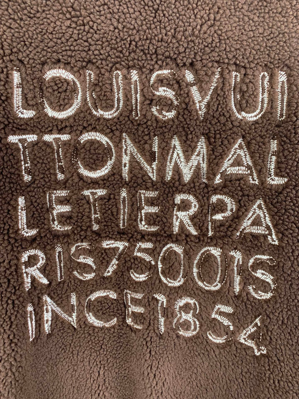 Brown plush vest with embroidered LOUIS VUITTON TONMAL lettering