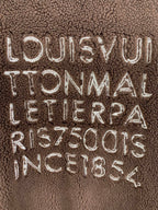 Brown plush vest with embroidered LOUIS VUITTON TONMAL lettering