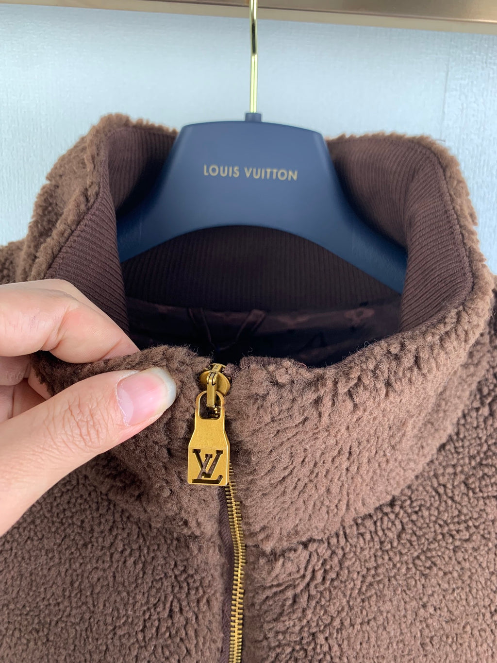 Louis Vuitton long jacket collar and gold LV zipper pull detail