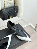 Chanel slingback pumps with black leather look and white pointed toe tips