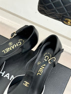 Chanel slingback pumps close-up showing gold hardware and "CHANEL" branding