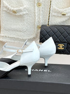 Chanel ladies slingback heels, white leather with gold buckle and slim stiletto heel