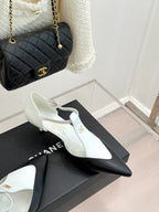 Chanel ladies slingback heels, white pointed toe with black heel tip and gold logo