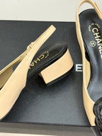 Women’s Chanel slingback heel detail, cream upper and black interior lining