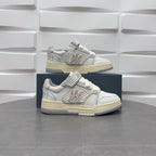 Amiri low-top sneakers pair in white with patterned side strap and lace details