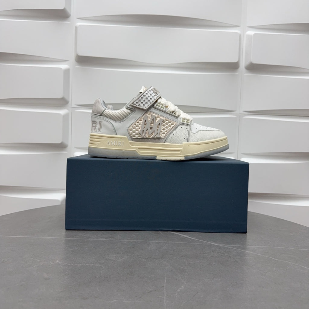 Amiri low-top sneakers in white with studded side strap and light sole