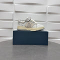 Amiri low-top sneakers in white with studded side strap and light sole