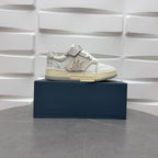 Amiri low-top sneakers in white with studded side strap and light sole