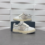 Amiri low-top sneakers in white with studded strap, lace-up, and chunky sole