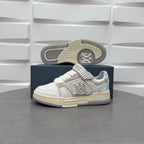Amiri low-top sneakers with visible outsole tread, white upper and beige sole