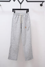 Heather gray sweatpants with drawstring and small Louis Vuitton emblem on leg
