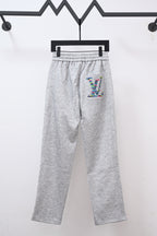 Gray sweatpants with drawstring, elastic waist, and colorful LV logo patch