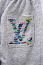 Gray sweatpants pocket with colorful LV graphic detail