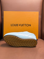 White Louis Vuitton low-top sneaker sole with textured tread and gold-brown outsole edge