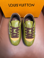 Green lace-up sneakers with dark brown laces and side LV emblem