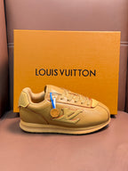 Louis Vuitton luxury sneakers in light tan with lace-up front and logo patch