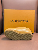 Louis Vuitton luxury sneakers, light tan, outsole view with textured tread