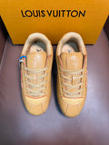 Louis Vuitton luxury sneakers in light tan with lace-up front and side logos