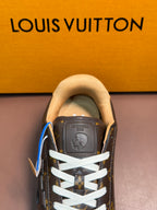 Louis Vuitton monogram sneaker top view, white laces and padded tan collar