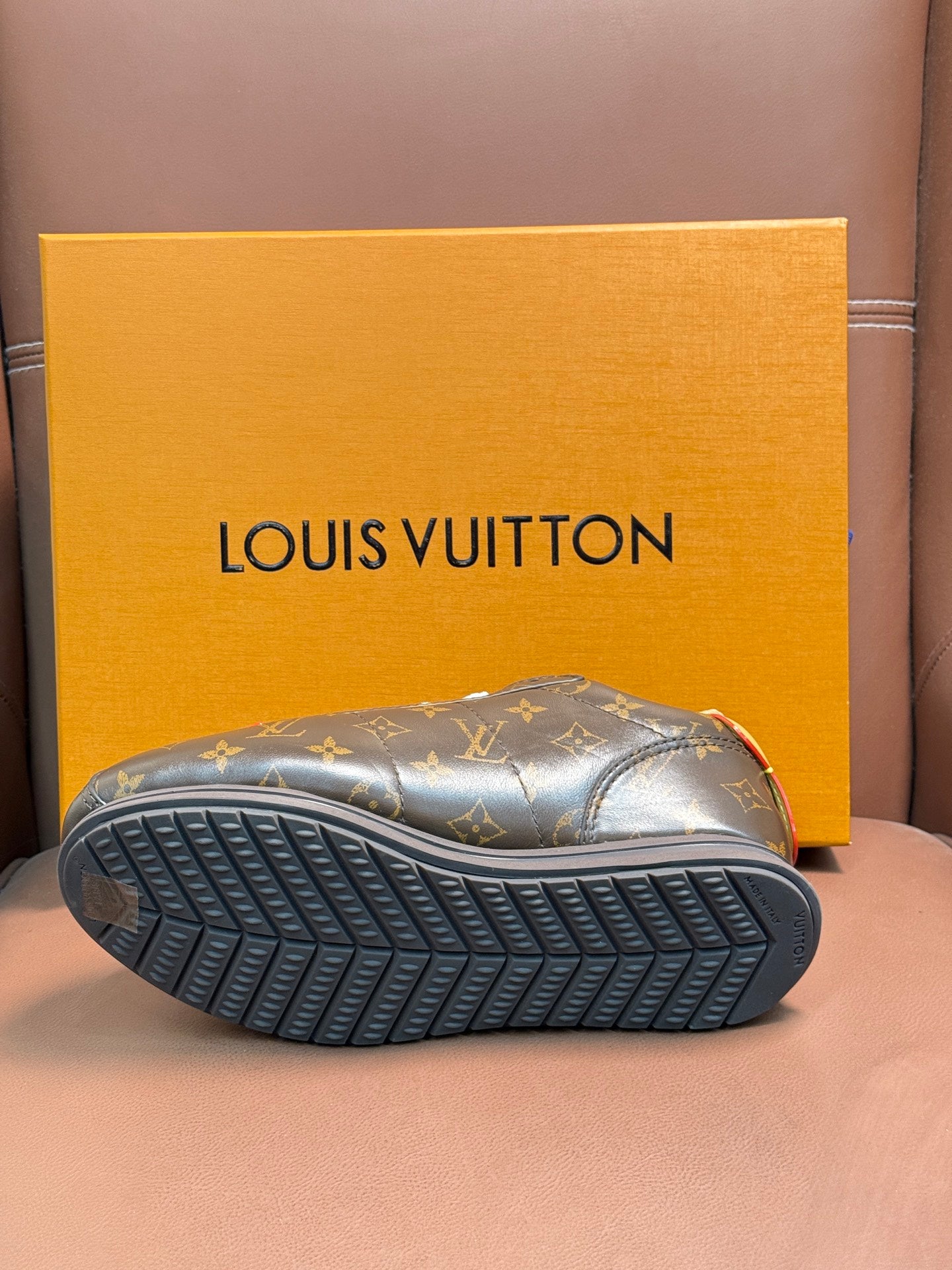 Louis Vuitton monogram sneaker outsole with deep tread pattern, dark rubber base