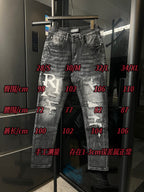 Light-wash distressed denim jeans with RI logo patch and distressed front knees