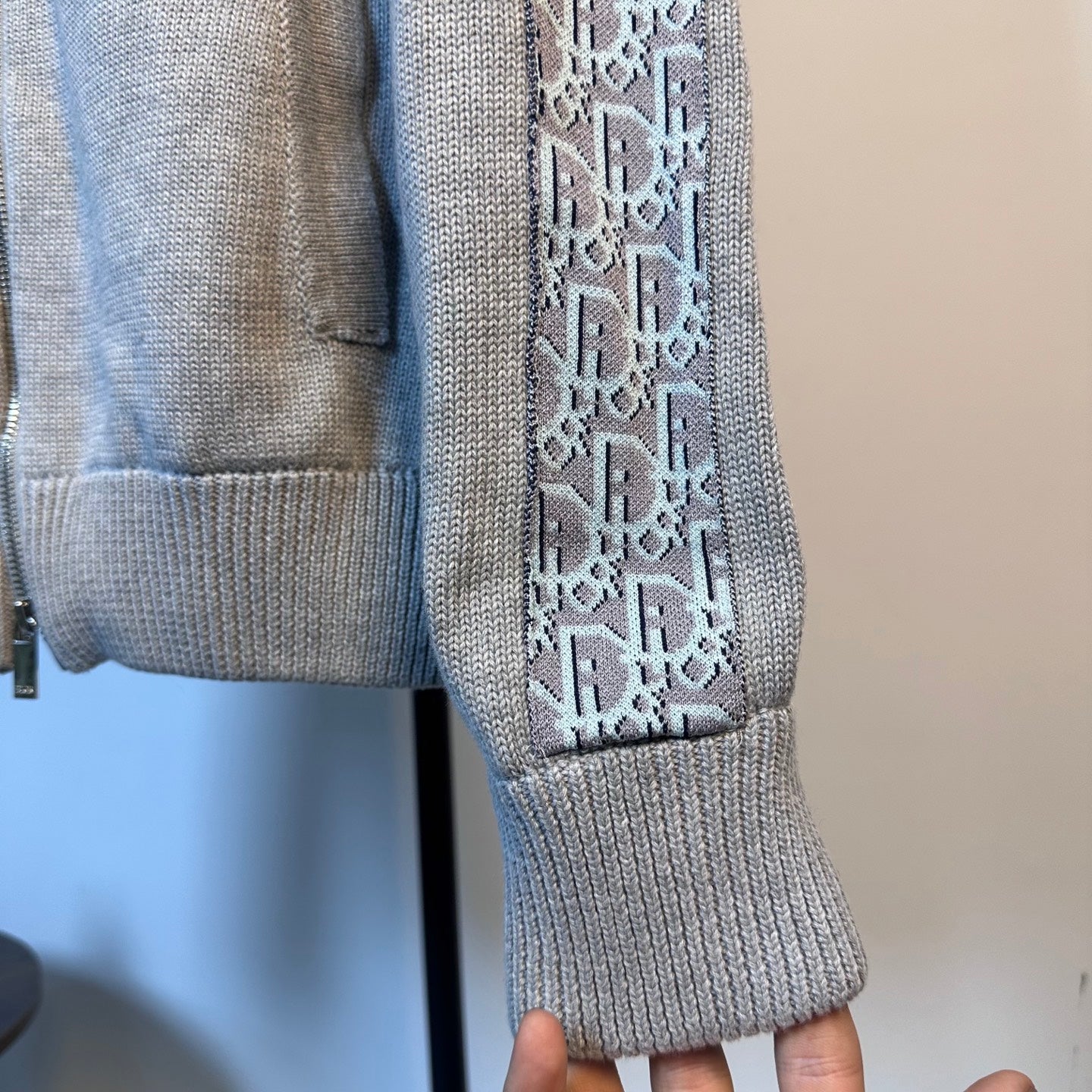 Light blue knit sweater cuff with ribbed sleeve end and patterned side panel trim