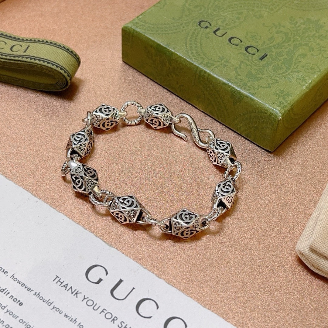 Silver logo-link bracelet with round clasp detail