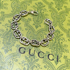 Silver-tone chunky link bracelet with interlocking oval links and clasp