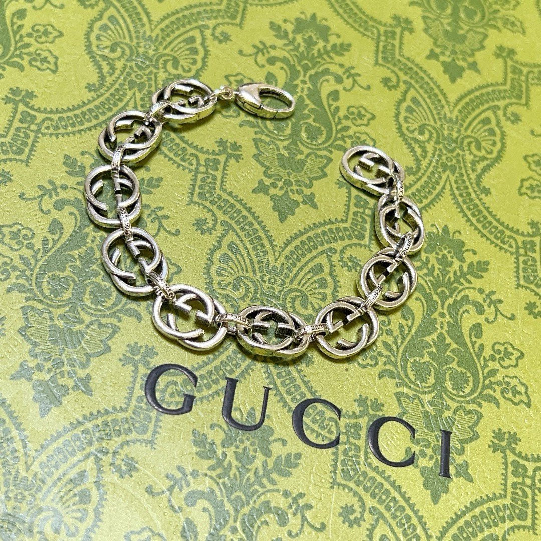 Silver-tone chunky link bracelet with interlocking oval links and clasp