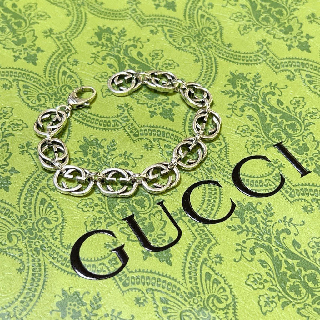 Silver-tone chunky link bracelet lying flat, interlocking oval chain links