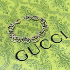 Silver-tone chunky link bracelet lying flat, interlocking oval chain links