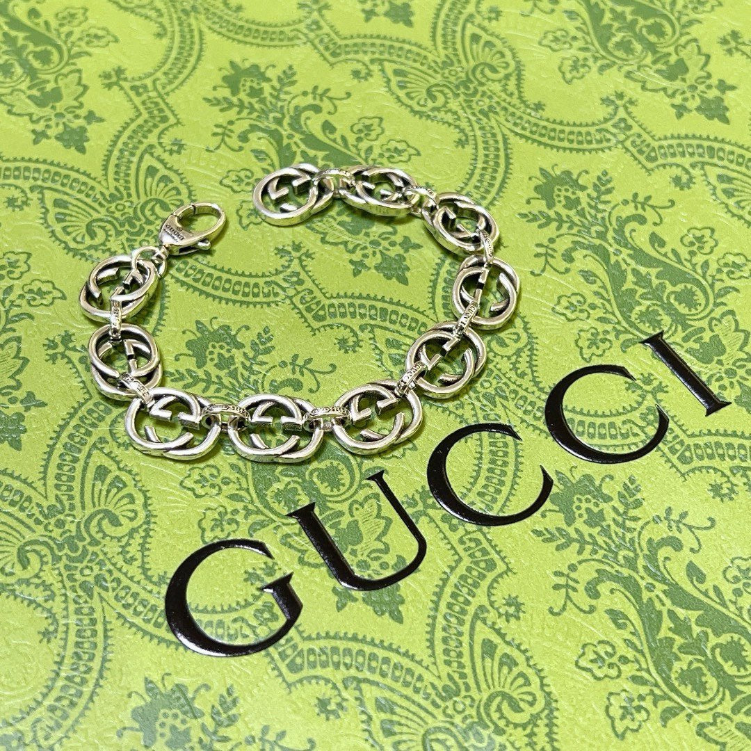 Silver-tone chunky link bracelet lying flat, interlocking oval chain links