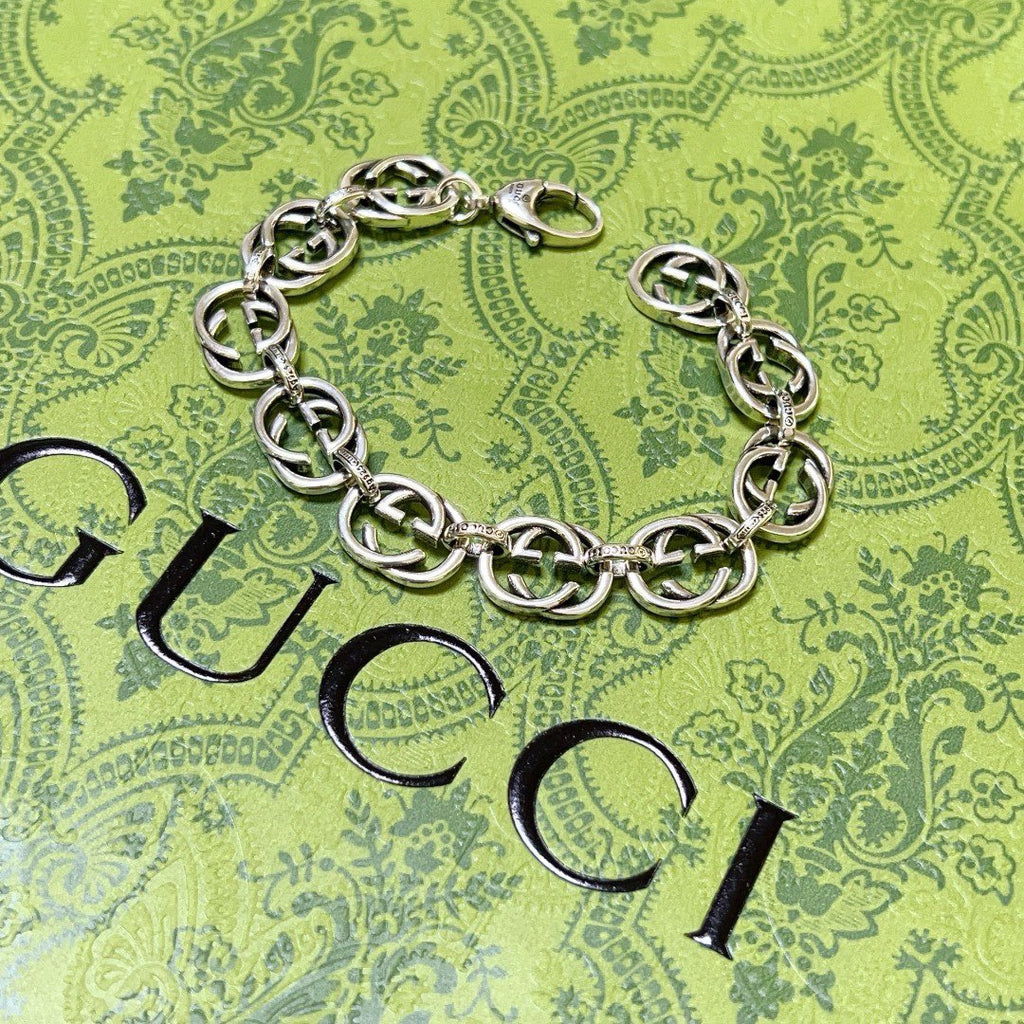 Silver-tone chunky link bracelet with clasp and interlocking oval links