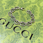 Silver-tone chunky link bracelet with clasp and interlocking oval links