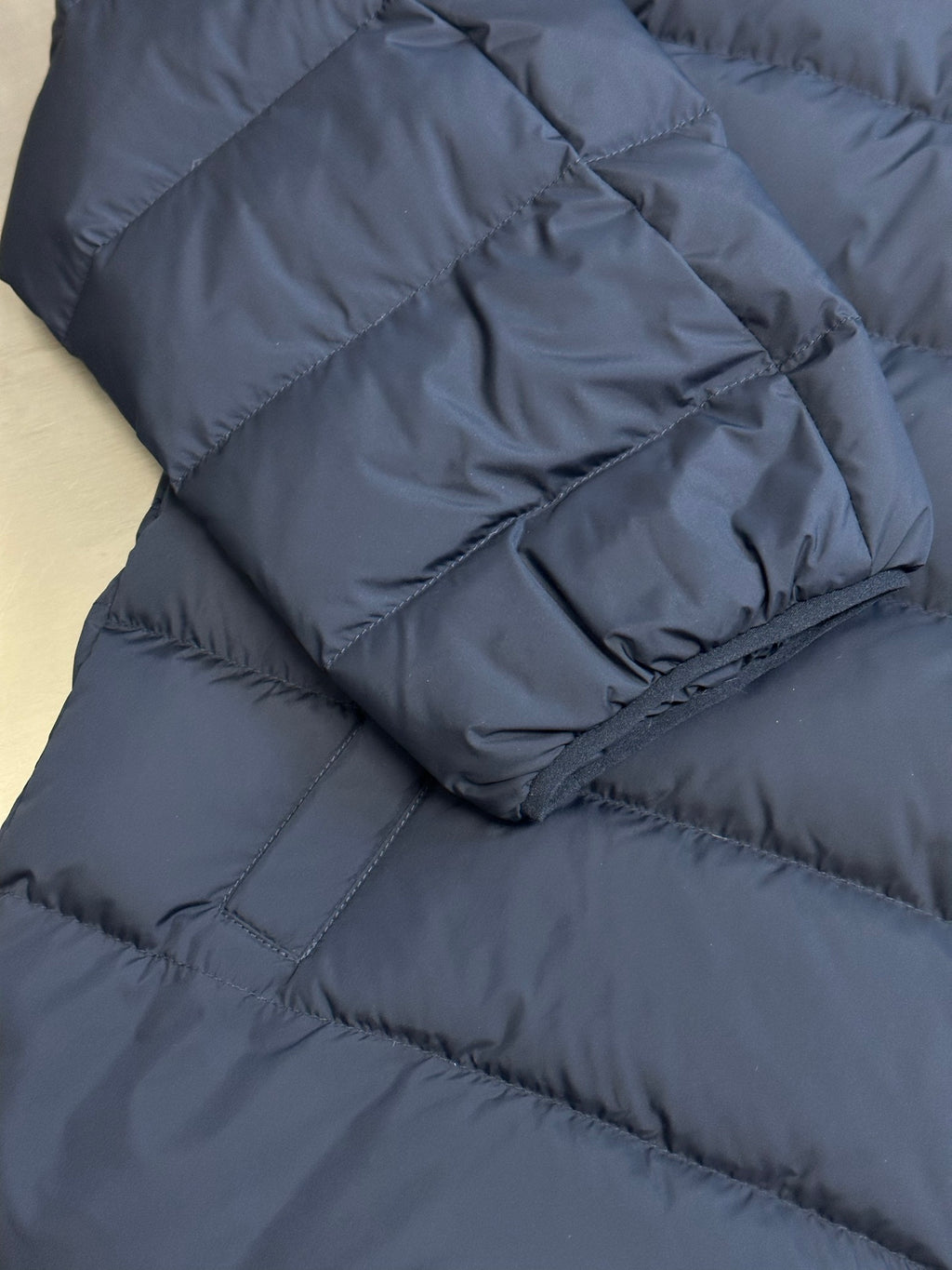 Ralph Lauren puffer jacket sleeve cuff, navy blue quilted fabric