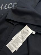 Dark navy T-shirt with inner neck label and size tag marked S