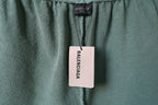 Balenciaga shorts with brand tag hanging from the waistband area